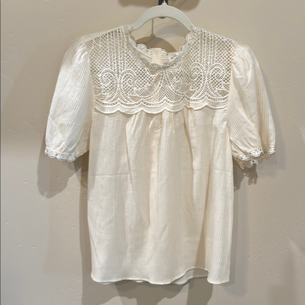 Cream Ruffled Blouse with Bib Collar and Short Sleeves